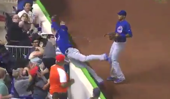WATCH: Baez dives into crowd to catch flyball