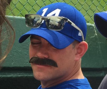 Photo: Epstein in bleachers with awesome fake mustache