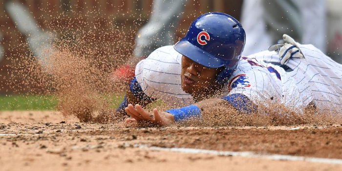 An overturned call involving an Addison Russell slide ruined a potential ninth-inning rally for the Cubs. (Photo Credit: Patrick Gorski-USA TODAY Sports)