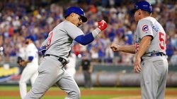 Led by Baez, Cubs overcome rain to dethrone Royals