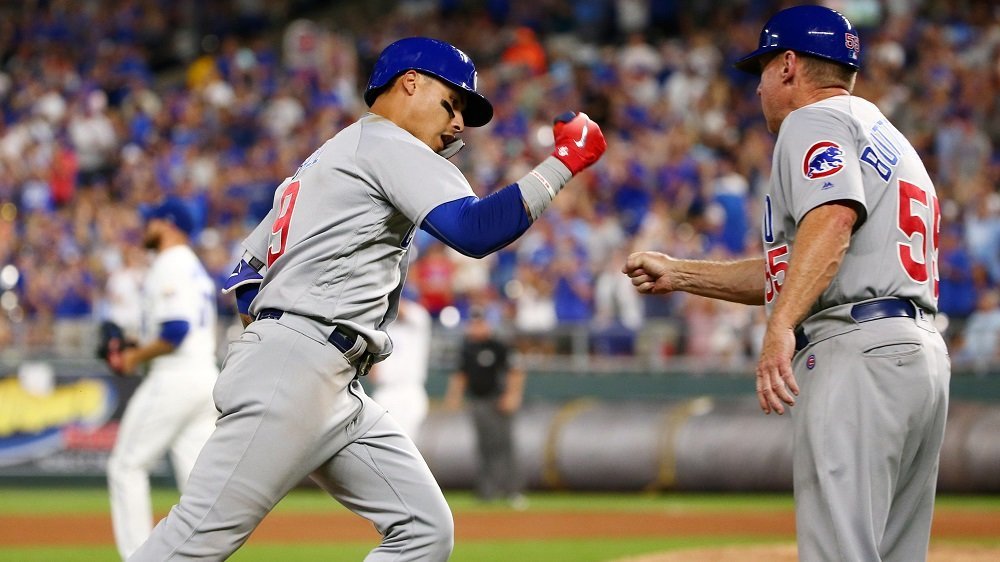 Led by Baez, Cubs overcome rain to dethrone Royals