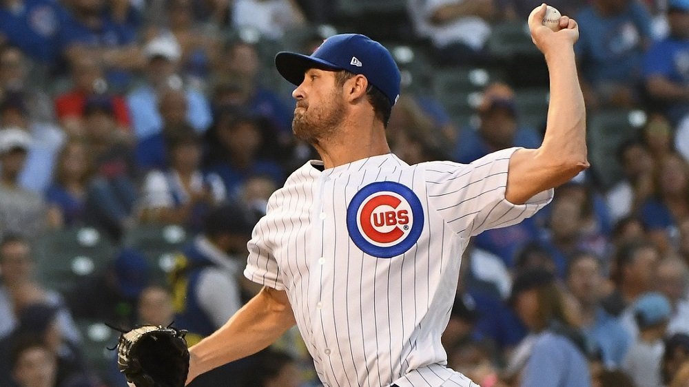 Hamels pitches complete game as Cubs wallop Reds