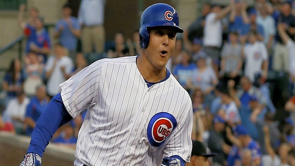 Anthony Rizzo grinned like the cat that ate the canary when he noticed himself on a nearby television screen. (Credit: Jim Young-USA TODAY Sports)