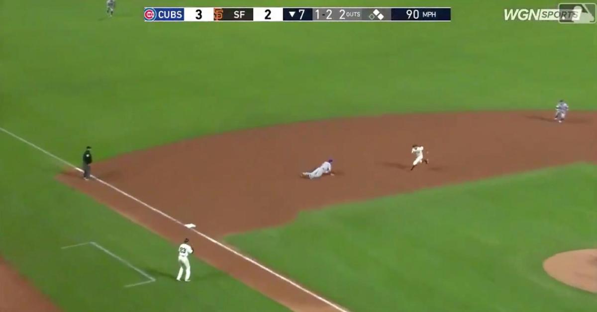 Kris Bryant laid out for a superb diving stop that helped the Cubs remain in front of the Giants.