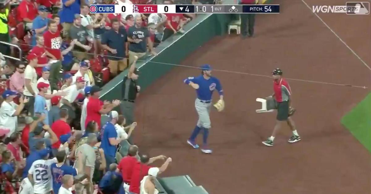 Kris Bryant tracked down a popup hit into foul territory and completed the catch, even after colliding with the partition.