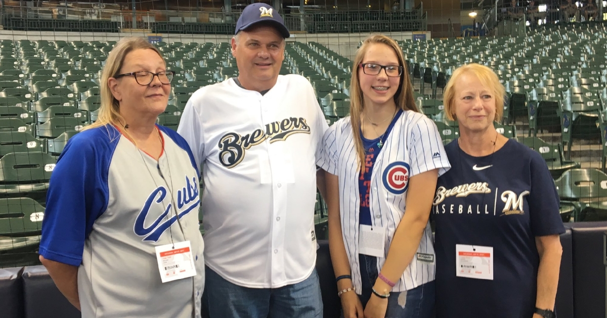 Brewers fan Tom Schroeder had the opportunity to meet the family of the Cubs fan from whom he received a heart last year. (Credit: @Aurora_Health on Twitter)
