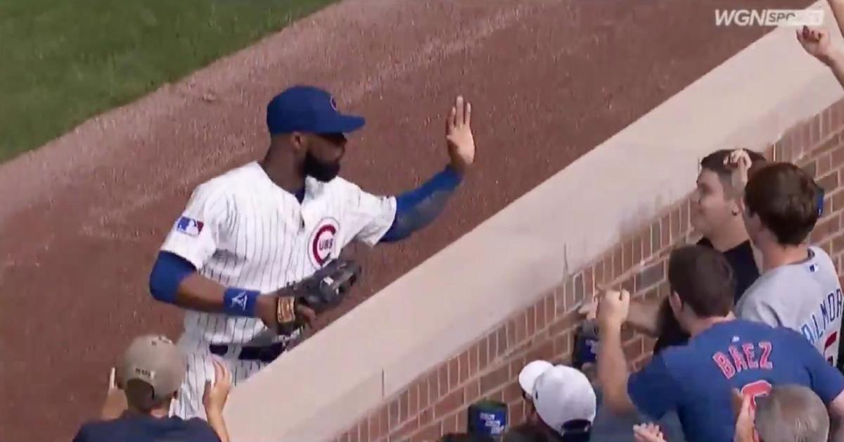 Jason Heyward made a nice gesture by turning back to give a young Cubs fan a high-five after securing a catch in foul ground.