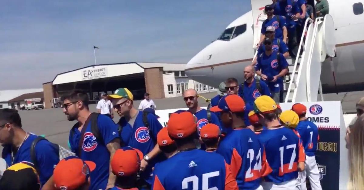 A sizable group of Little League players served as the Chicago Cubs' welcoming party at the airport.