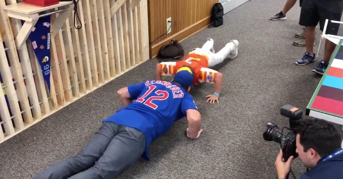 Chicago Cubs left fielder Kyle Schwarber took part in a friendly push-up contest with a Little League player.