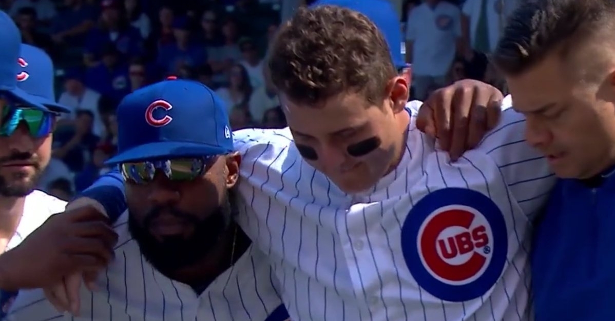 Chicago Cubs first baseman Anthony Rizzo was forced to leave the game after rolling his ankle while charging toward a bunted ball.