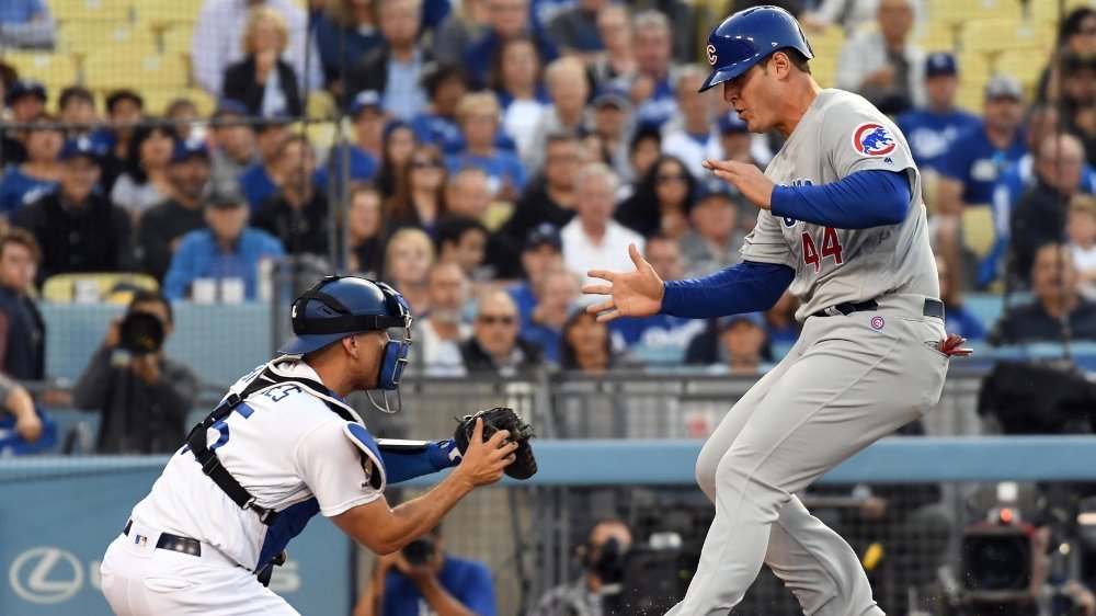 Anthony Rizzo was forced to make a futile attempt at stealing home after getting caught in a rundown. (Credit: Richard Mackson-USA TODAY Sports)