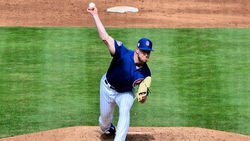 Cubs place reliever on IL, call up righty pitcher