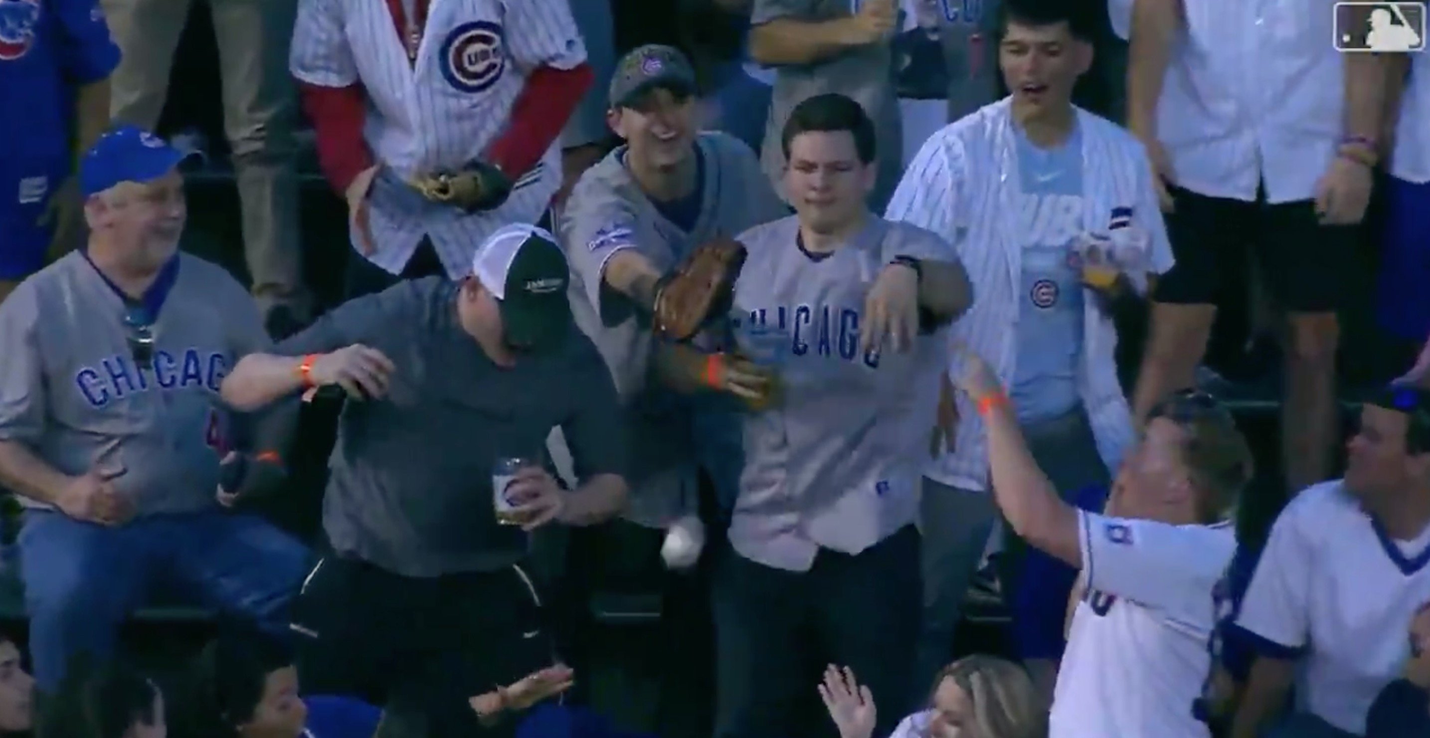 This passionate Cubs fan had no desire to keep a baseball thrown into the stands by an opposing player.