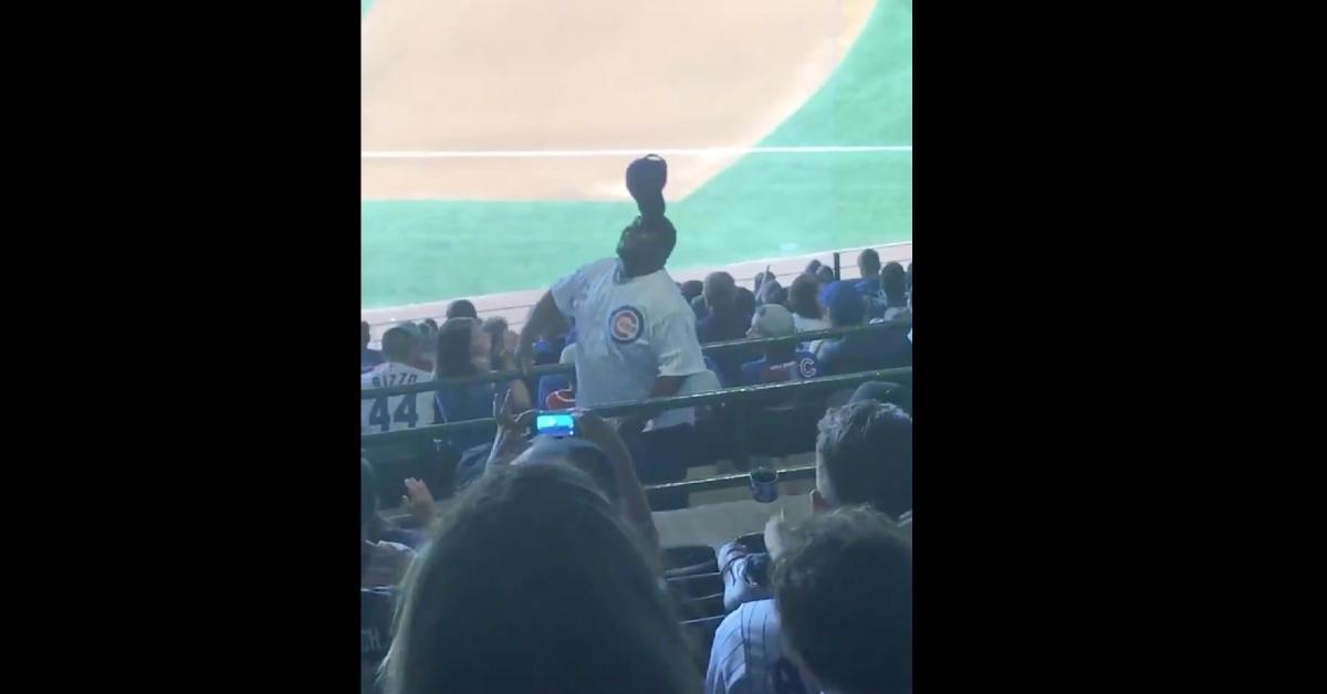A section of fans at Wrigley Field were treated to a show when a man combined a lively dance routine with a balancing act. (Credit: Jerry Lai-USA TODAY Sports)