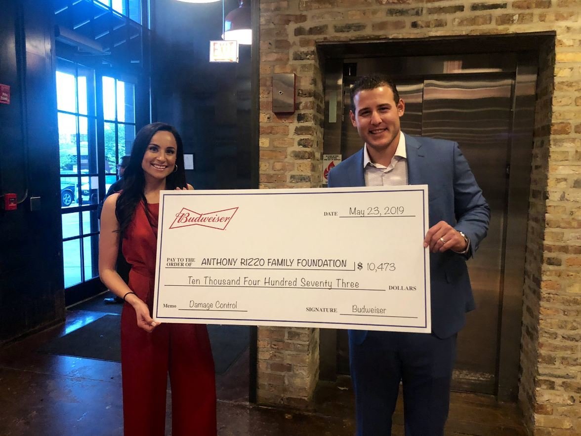 Anthony Rizzo and his wife, Emily, posed with the super-sized check made out for Budweiser's generous donation.