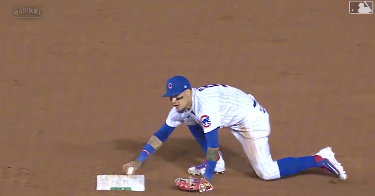 Javier Baez tagged second base in the most literal way possible, as he touched the bag with the baseball.
