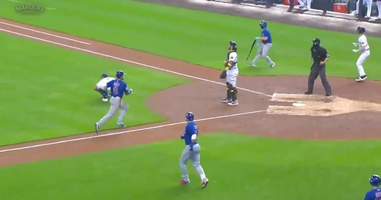 On a wacky play, Javier Baez tagged up and scored once he caught the Brewers sleeping.