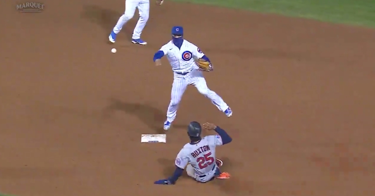Javier Baez hopped off second base and hurled a perfect throw to first base as part of a double play in the top of the ninth.