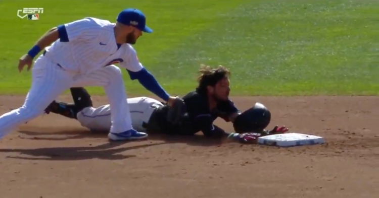 David Bote applied the tag on Miguel Rojas right before Rojas touched the bag.