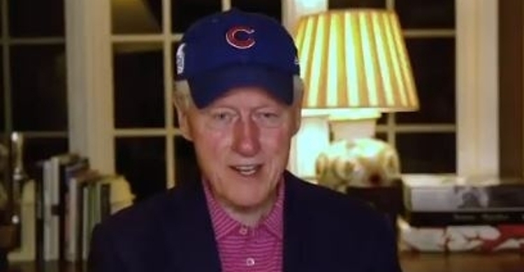 Former President Bill Clinton donning a Cubs hat