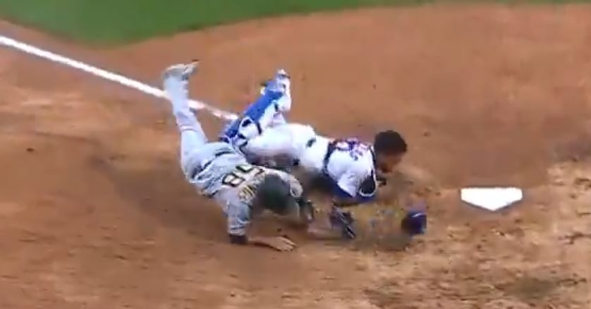 Jacob Stallings collided with Willson Contreras, who tagged Stallings out after receiving a throw from Kyle Schwarber.