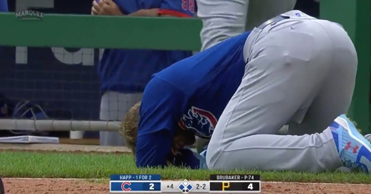 Ian Happ remained on the ground in pain for several moments after a foul ball bounced up and hit his face.