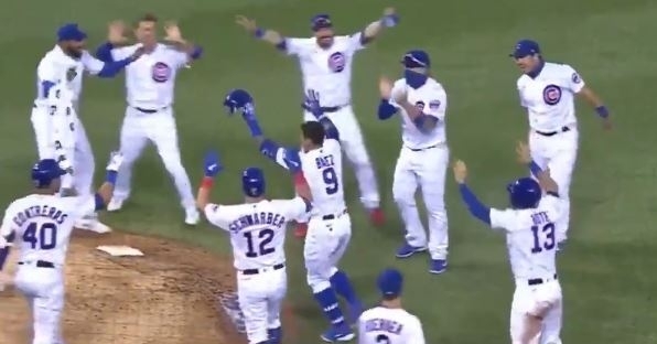 The Cubs celebrate after Baez's walk-off single