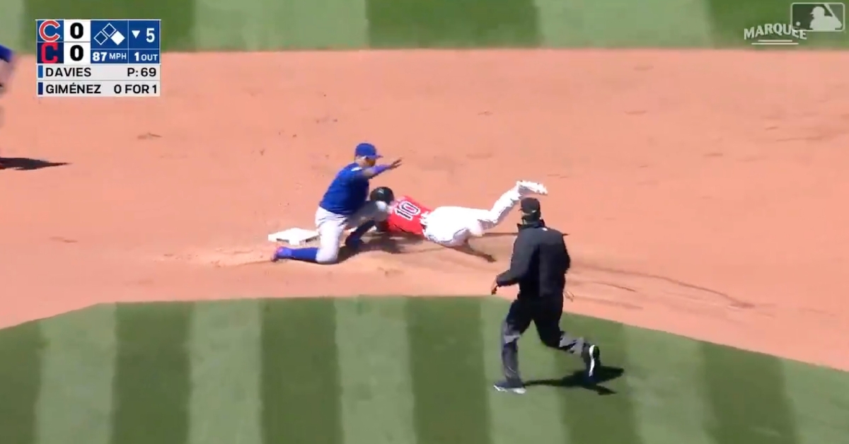 Javier Baez applied a no-look tag as part of a 
