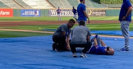 Bote down in pain during pregame warmups (Photo via Jon Greenberg of the Athletic)