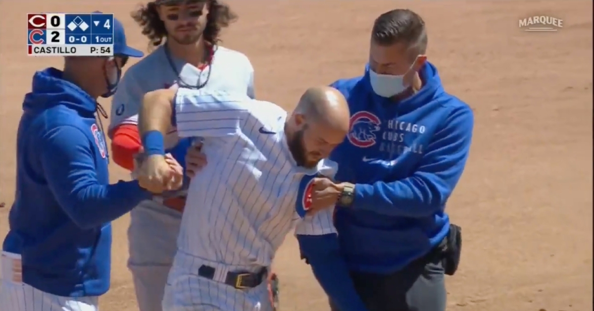 David Bote walked off the field in obvious pain after suffering an apparent left shoulder injury on a slide.