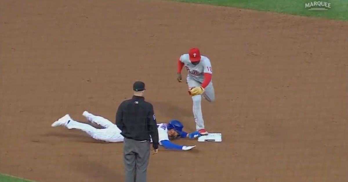 Kris Bryant was shaken up after having his left hand cleated on the basepaths in the bottom of the first.