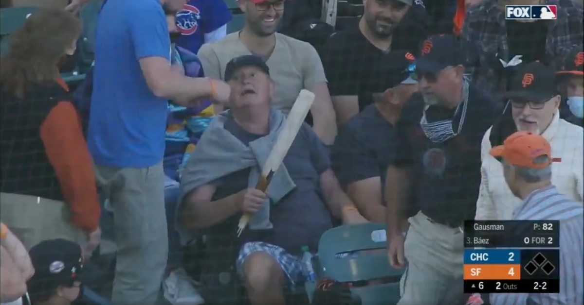 A fan at Saturday's Cubs-Giants game collected a souvenir by hauling in the barrel of Javier Baez's broken bat.