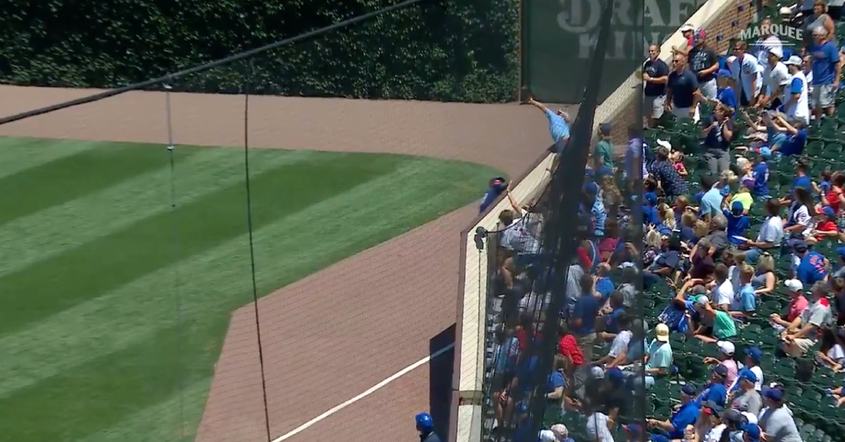 Jason Heyward was in position to catch a fly ball near the padded wall down the right field line when an overeager fan reached out and caught it himself.