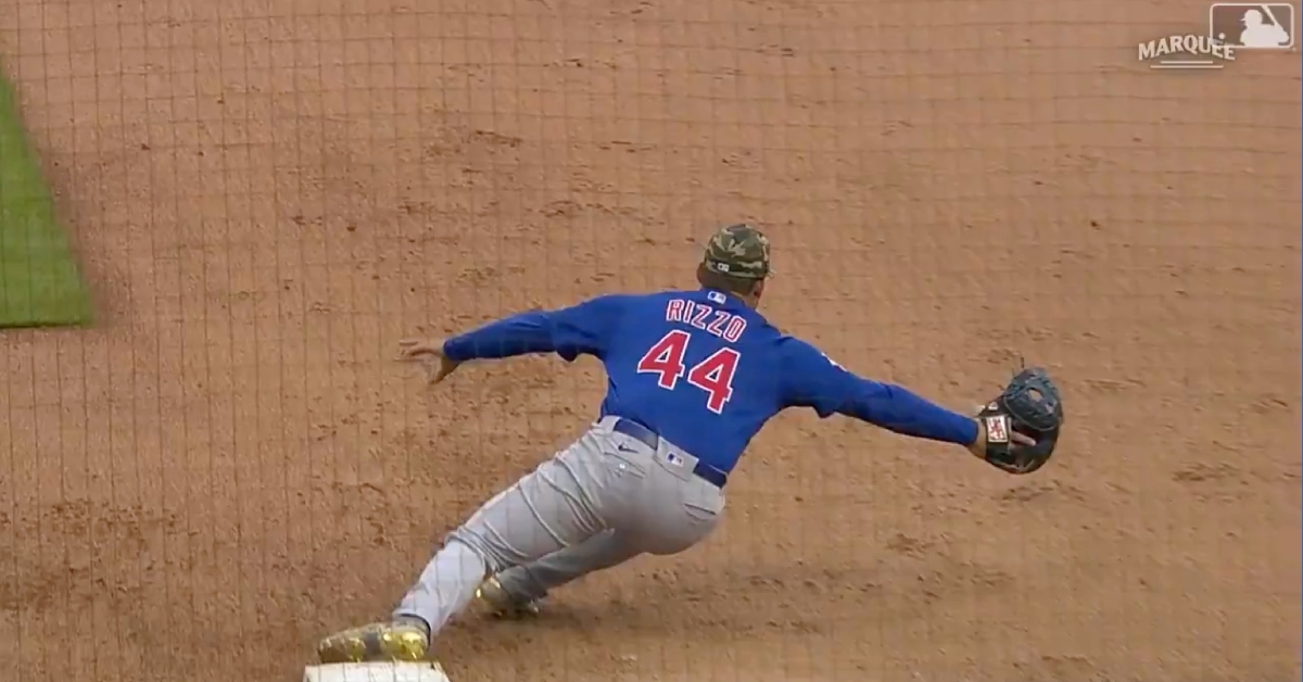 Anthony Rizzo fully extended in order to make a catch at first base that bailed out Javier Baez.