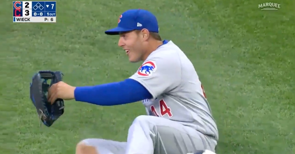 Anthony Rizzo could not help but grin after tripping and falling while fielding a grounder.