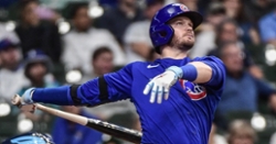 Happ powers Cubs past Milwaukee in extras