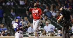 Reds use four-run sixth to defeat Cubs