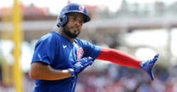 Cubs blast Reds to earn series split