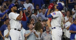 Cubs make history in offensive fireworks against Reds
